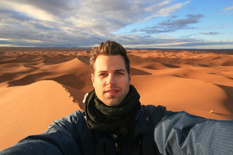 Male Solo Traveler Taking Selfie 